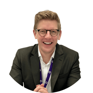 headshot of Dr Tom Bamford wearing a suit