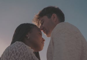 couple with closed eyes facing each other